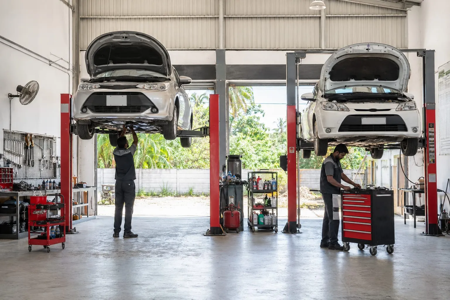 Technicians working in a vehicle garage